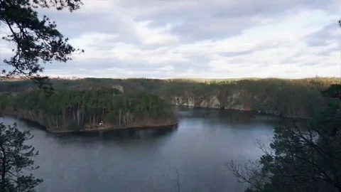 Fast forward landscape scene. Clouds passing over river. Trees in a strong wind Stock Footage 69324660