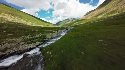 Fast forward movement along a rocky mountain river Stock Footage 344419759
