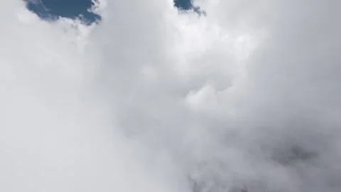 Fast forward movement through dense white and grey clouds Stock Footage 345710807