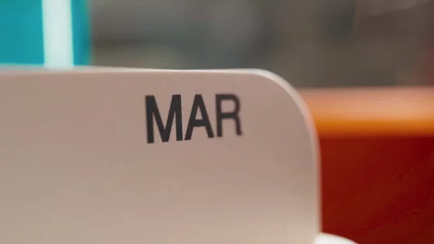 Fast Forward Time Lapse of Calendar Months Changing by Hand Stock Footage 331915273