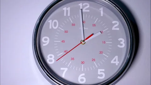 Fast-Forward Time-Lapse of a Grey Clock with a Red Second Hand 動画素材 337137888