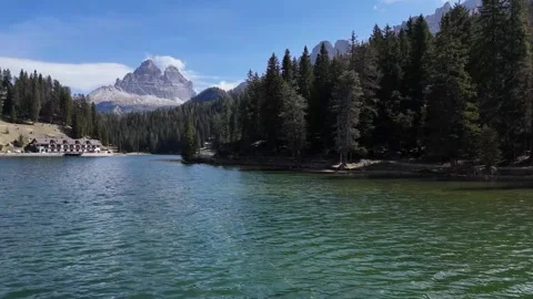 Fast Forward Water Surface Skim Shot Opening Up Grand Mountain Vista Stock Footage 340448827