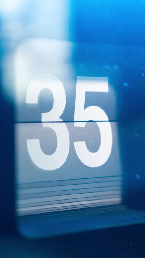 Fast-forwarding Seconds display of Vintage Flip Clock in blue light environment Stock Footage 314762832