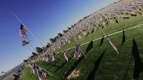 Fast FPV Drone Entry to American Flag Field - Half-Staff Tribute Stock Footage 332025725