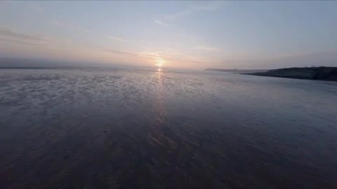 Fast FPV drone flight low above ground at sunset Stock Footage 330669174