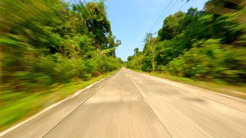 Fast FPV drone flight over tropical road Stock Footage 248676641
