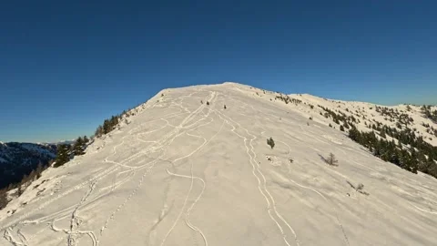 Fast FPV Drone Flying Over Majestic Snowy Winter Mountain Landscape Stock Footage 321150128