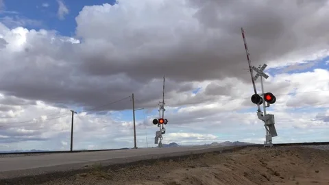 Fast Freight Train at Crossing with Clouds, Active Signal and Container Cars Stock Footage 72328680