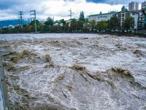 Fast full-flowing river under the pedestrian bridge in Sochi Russia Stock Photos