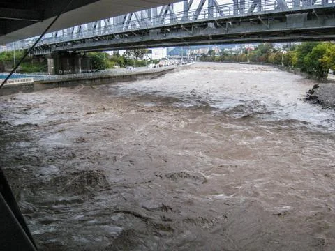 Fast full-flowing river under the pedestrian bridge in Sochi Russia Stock Photos