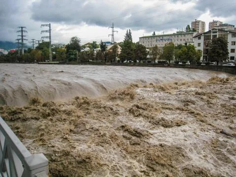 Fast full-flowing river under the pedestrian bridge in Sochi Russia Stock Photos