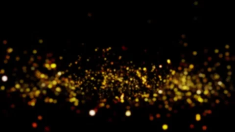 Fast golden bokeh particles flowing across a black background 库存影片 346426624