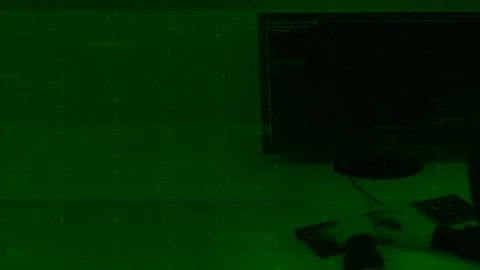 Fast hands programmer enter code on keyboard, Green background Stock Footage 115052636