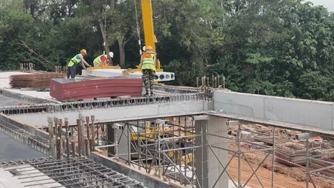 Fast Installation of Precast Hollow Core Slabs on Construction Site Stock Footage 332835396