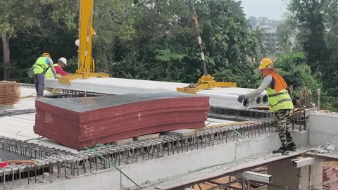 Fast Installation of Precast Hollow Core Slabs on Construction Site Stock Footage 332835420