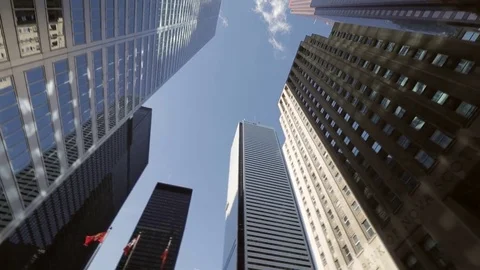 Fast left pan of tall office tower in financial district Stock Footage 73966095