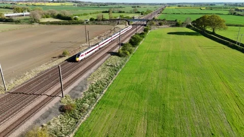 Fast LNER train heading south on the East Coast Mainline Stock Footage 312074718