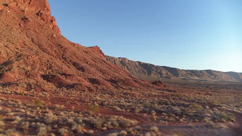 Fast low aerial through St George Utah desert red cliffs Stock Footage 264469763