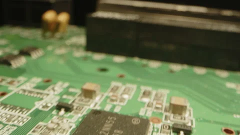 Fast macro dolly over a circuit board with diodes, microchips and transistors Stock Footage 315630968
