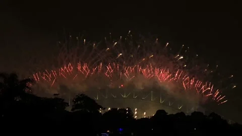 Fast Midnight New Year fireworks in Sydney city above Harbour bridge 4k. Stock Footage 145890419
