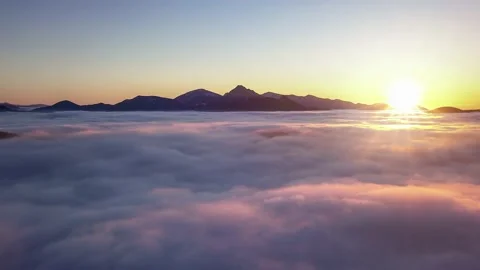 Fast motion above clouds nature at sunrise in alpine mountains Aerial Time lapse 動画素材 145017668