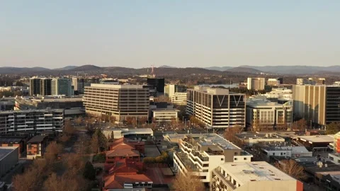 Fast motion aerial flying over Canberra city CBD streets and houses in Australia Stock Footage 297602626