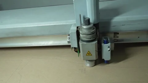 Fast Motion of Automated Machine Head Cutting Leather Stock Footage 322057654