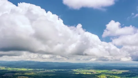 Fast motion clouds in blue sky above green nature in New Zealand Time lapse Stock Footage 145831436