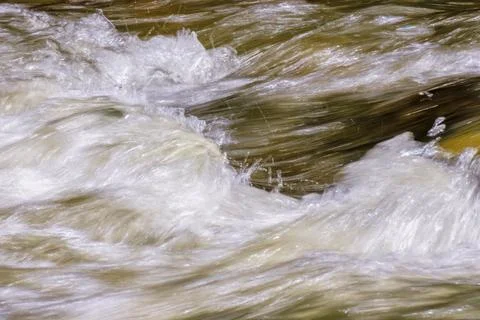 The fast motion of the current on the surface of the water Stock Photos