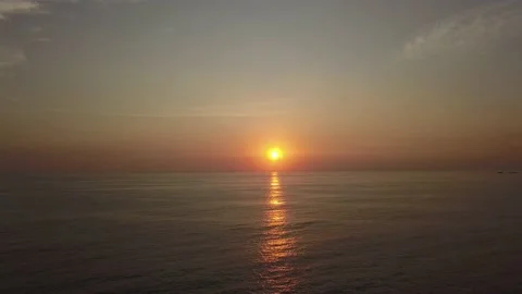 Fast motion drone aerial view of a beautiful sunset moving over the sea with the Stock Footage 195994252