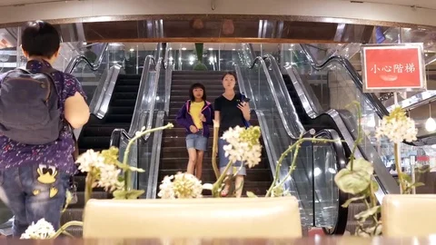 Fast motion of people taking escalator inside shopping mall main entrance Video stock 82518233