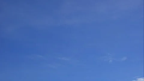 Fast motion of white clouds under sunlight shows transition, openness, and Stock Footage 325034915