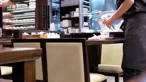 Fast motion of worker cleaning table after customer leaving with heavy steam Stock Footage 90362296