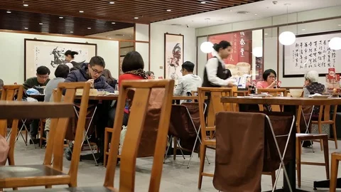 Fast motion of worker serving foods for customer inside restaurant Video stock 84532312