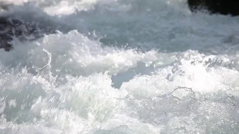 Fast mountain river closeup. Foam river Stockbeeldmateriaal 84042577