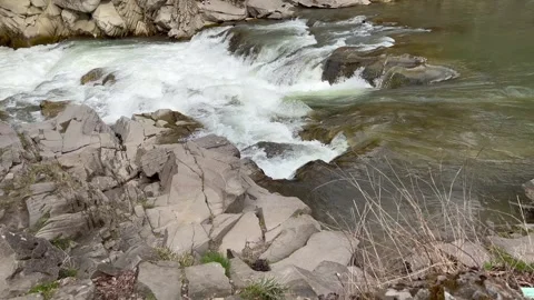 Fast mountain river flowing over rocks in a narrow gorge Stock Footage 314030499