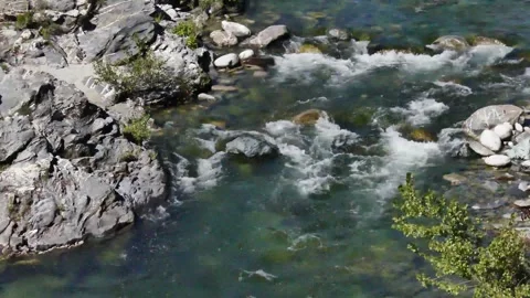 A fast mountain river running between rocks, Corsica Stock Footage 326411557