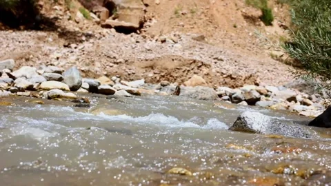 Fast mountain river stream water flowing through the rocks close up Stock Footage 221133764