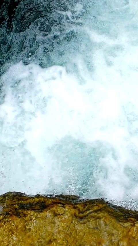 Fast mountain river water flowing over rocks with foam Video stock 331935002