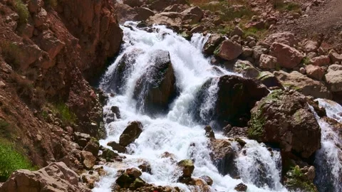 Fast mountain river water stream waterfall flowing near the rocky shore Stock Footage 255972931