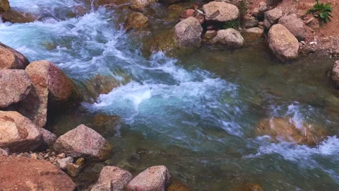 Fast mountain river water stream with waves flowing near the rocky shore Stock Footage 260412960