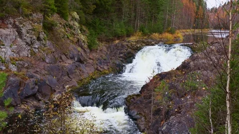 Fast mountain river water stream waterfall flowing near the rocky shore Stock Footage 297478429