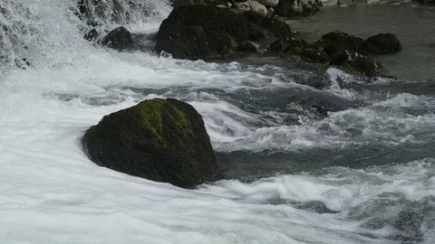 Fast mountain river with waterfall. View of a fast moving river with rapids. Stock Footage 114954545
