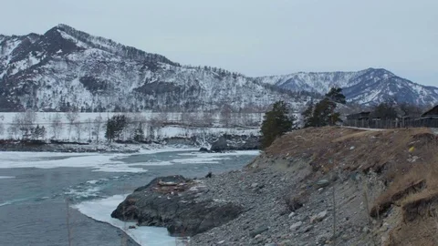 Fast mountain river in winter. Dull day/evening Stock Footage 73616929