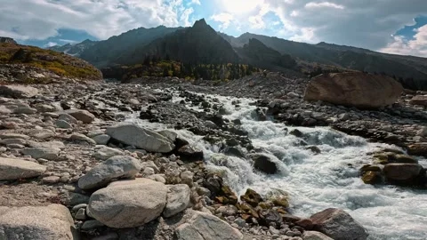 Fast mountain stream among rocks and cliffs Video stock 317705309