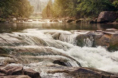 Fast mountain stream Stock Photos