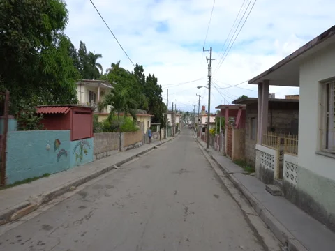 Fast movement along narrow street on local cuban village Stock Footage