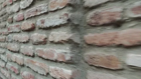 Fast movement along an old brick wall Vidéo 310301150