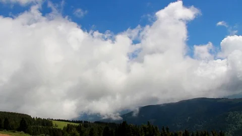 Fast movement of clouds over mountains Stock Footage 108490782