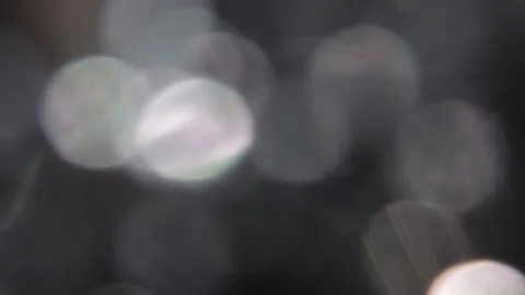 Fast movement to the left, bright white bokeh lights, full screen Video stock 317450777